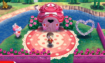 The outside of Gayle's heart themed home, including an illuminated heart PWP, in Animal Crossing: Happy Home Designer.