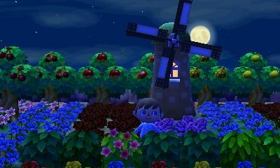 A windmill and flowers in the New Leaf dream town of Hula Key.