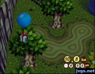 A balloon present (finally) gets caught in a tree.