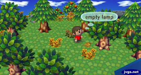 An empty lamp sitting on the ground.