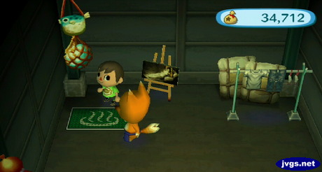 A decoration hanging on the wall in Crazy Redd's shop, and a bat mat on the floor.