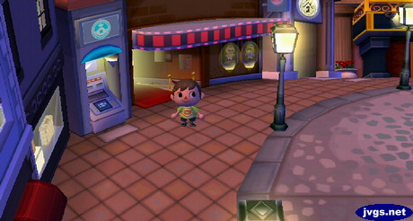 Standing near the marquee in the city.