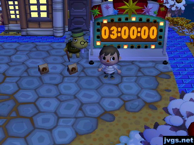 Exactly three hours (3:00:00) remaining on the countdown clock to the new year. Tortimer stands nearby.