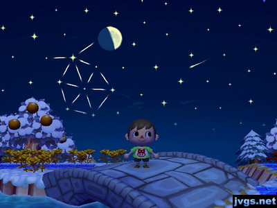 A shooting star flies by in the night sky.