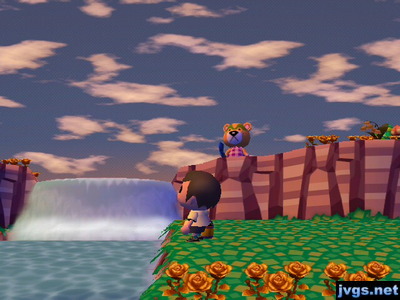 Nate standing on a cliff near the waterfall, staring blankly ahead.