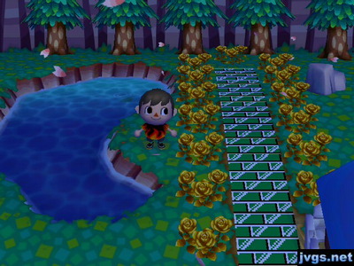 Standing near the Pac-Man pond as cherry blossom petals fall.