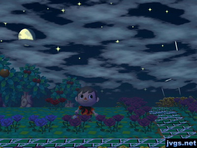 The moon peeking through clouds in the night sky.