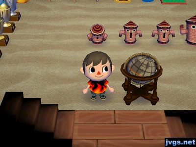 Me standing next to the cool globe I got from Tortimer on Nature Day.