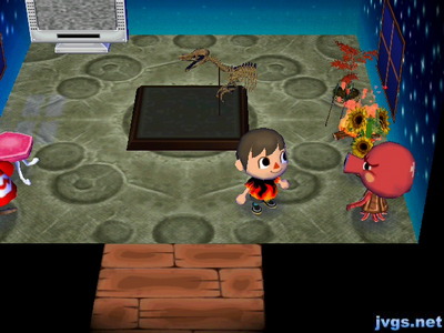 A campfire behind some flowers in Octavian's house.