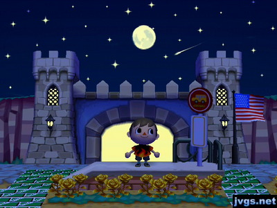 A look at a shooting star and the moon behind my castle shaped town gate.