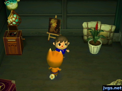 A turntable, a jolly painting, and a bromeliaceae for sale in Crazy Redd's shop.