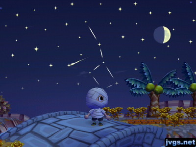 A shooting star flies by the Big Dipper constellation in the night sky.