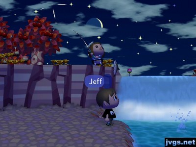 Yann catches a fish on top of the waterfall.