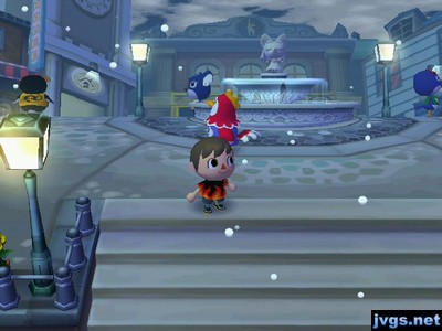 Snow falls in the city.