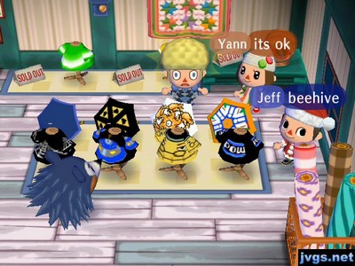 Megan, Yann, and Jeff in Able Sisters. Megan is wearing an afro wig.