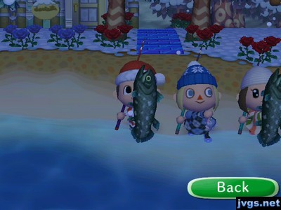 Megan holds up a small fish, while standing between Jeff and Yann, who are each holding a coelacanth.