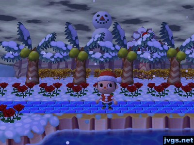 A huge snowman stands on the edge of the cliff, overlooking the land below.