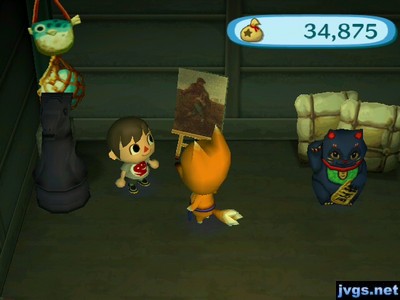 A black knight, a moody painting, and a lucky black cat for sale at Redd's shop.