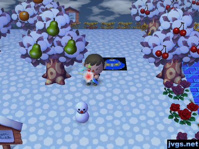 Me shooting a party popper at a tiny melted snowman.