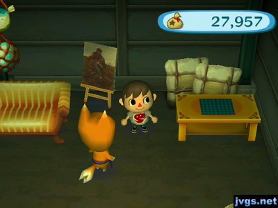 A classic sofa, a moody painting, and a ranch tea table on sale in Crazy Redd's shop.