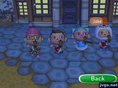 All four of us holding up the mole crickets we caught.