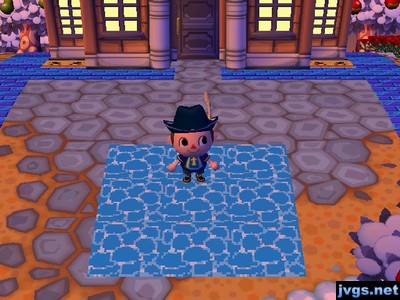 Nine water patterns in a square on the ground. They were clearly nine repeating patterns and did not appear as one continuous body of water.