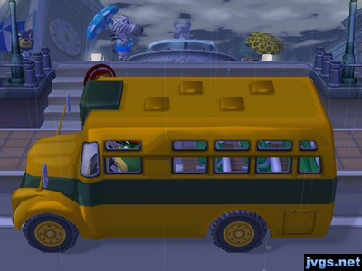 Rain falls in the city as the bus arrives.