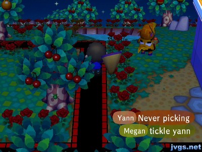 Anabelle's tail looking like a beak or nose coming from the Pac-Man ghost on the back of her shirt.