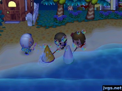 Jeff and Yann use nets to try to catch Megan's bubbles.