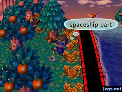 A spaceship part on the ground near the river.