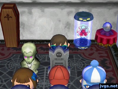 All four of us standing behind gravestones.