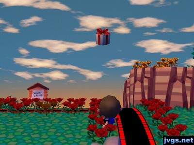 A balloon present falls to the ground after I hit it with my slingshot.