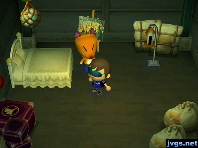 A regal bed, a calm painting, and a bird feeder on sale in Crazy Redd's shop.