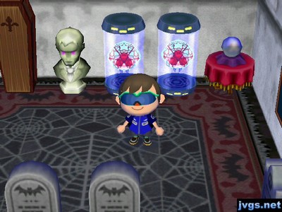 Two Metroids in my room of creepy furniture.