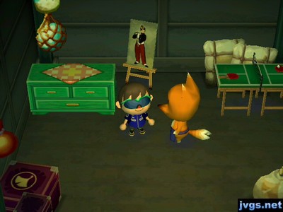 A green dresser, a nice painting, and a tennis table on sale in Crazy Redd's shop.