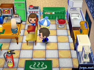 Yann, Megan, and Jeff "dancing" by chairs.