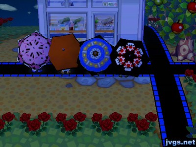 The four of us spinning umbrellas outside of Nook 'n' Go.