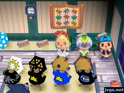 Megan, Jeff, and Yann posing near several sold-out signs in Able Sisters.