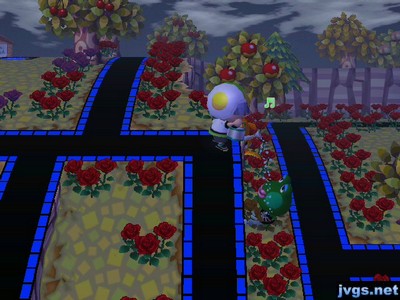 Standing on a cliff, sprinkling water on Jambette down below.