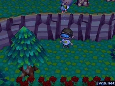 Yann (up on a cliff) sprinkles water down onto Jeff, who is wearing a snorkel mask.