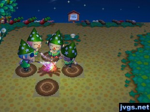 Jeff, Robin, Abbey, and Ronnie setting off fireworks at the campfire.