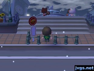 Snow falls in the city.