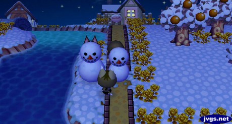 Two snowmen, one with cat ears.