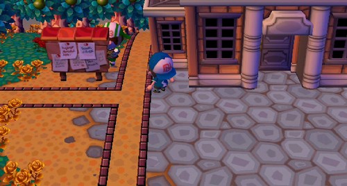 Big Top tries to hide behind the bulletin board.