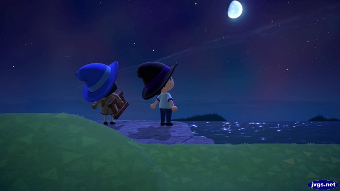 Two mages look up at the moon.