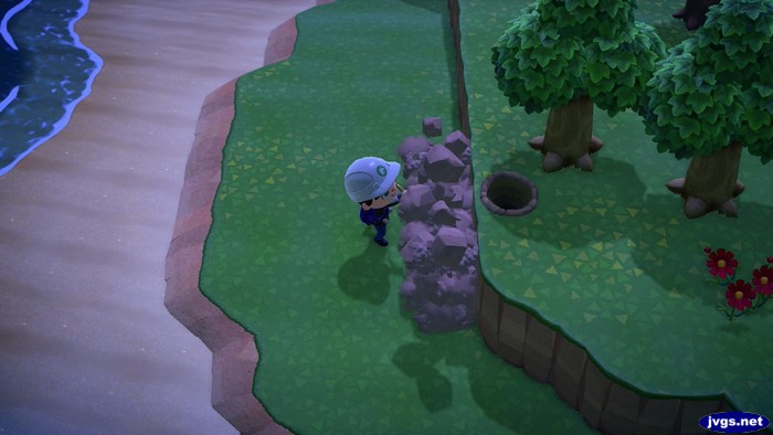 Jeff uses the island designer app to remove part of a cliff in Animal Crossing: New Horizons for Nintendo Switch.