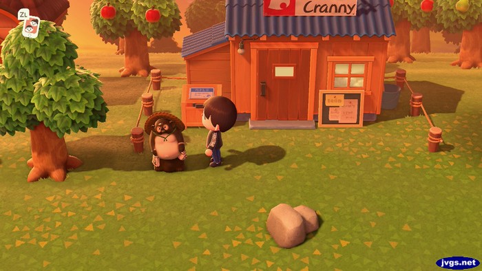 A raccoon figurine is placed in front of Nook's Cranny.