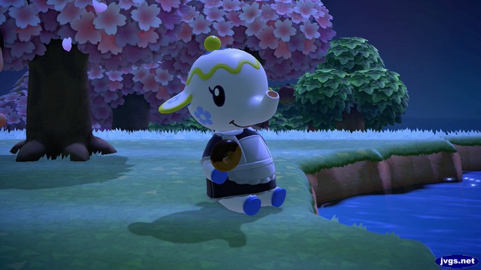 Tia holds a donut in Animal Crossing: New Horizons for Nintendo Switch.