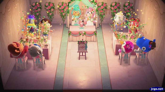 Everyone fires off party poppers at Reese and Cyrus' wedding reception party in Animal Crossing: New Horizons.