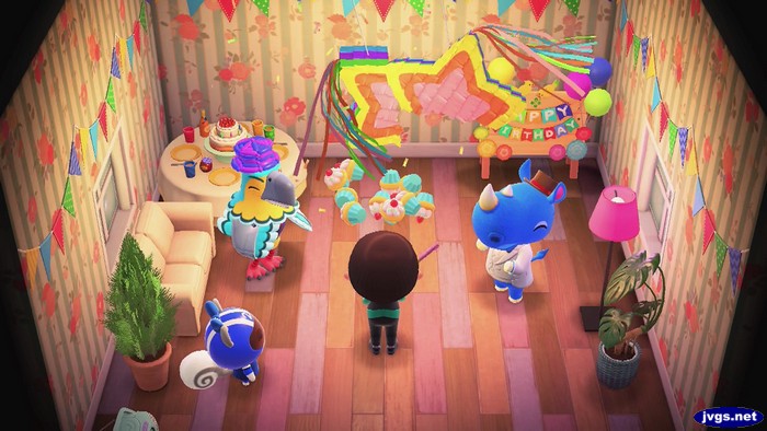Cupcakes fall out of a pinata on a birthday celebration in Animal Crossing: New Horizons.
